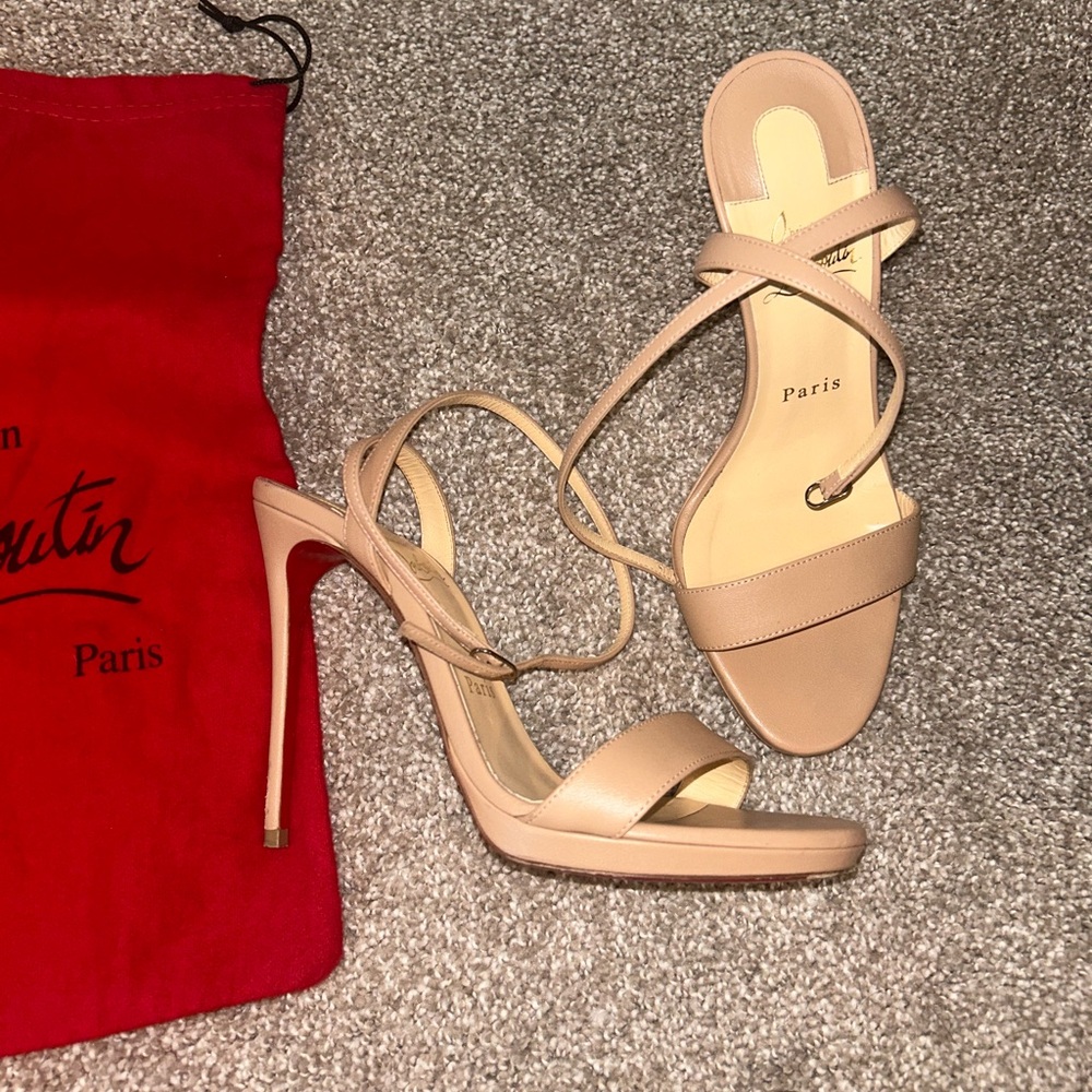 Christian Louboutin size 37 in a tan color. Heels have a few scuffs. 4in heel